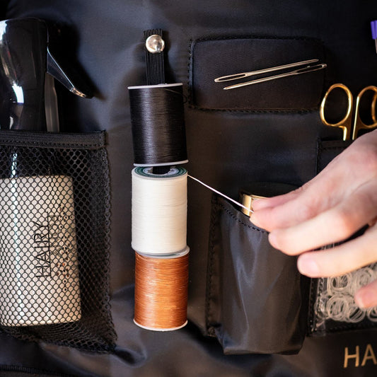 Three different colours of the plaiting thread being used with the Hairy Pony Plaiting Apron