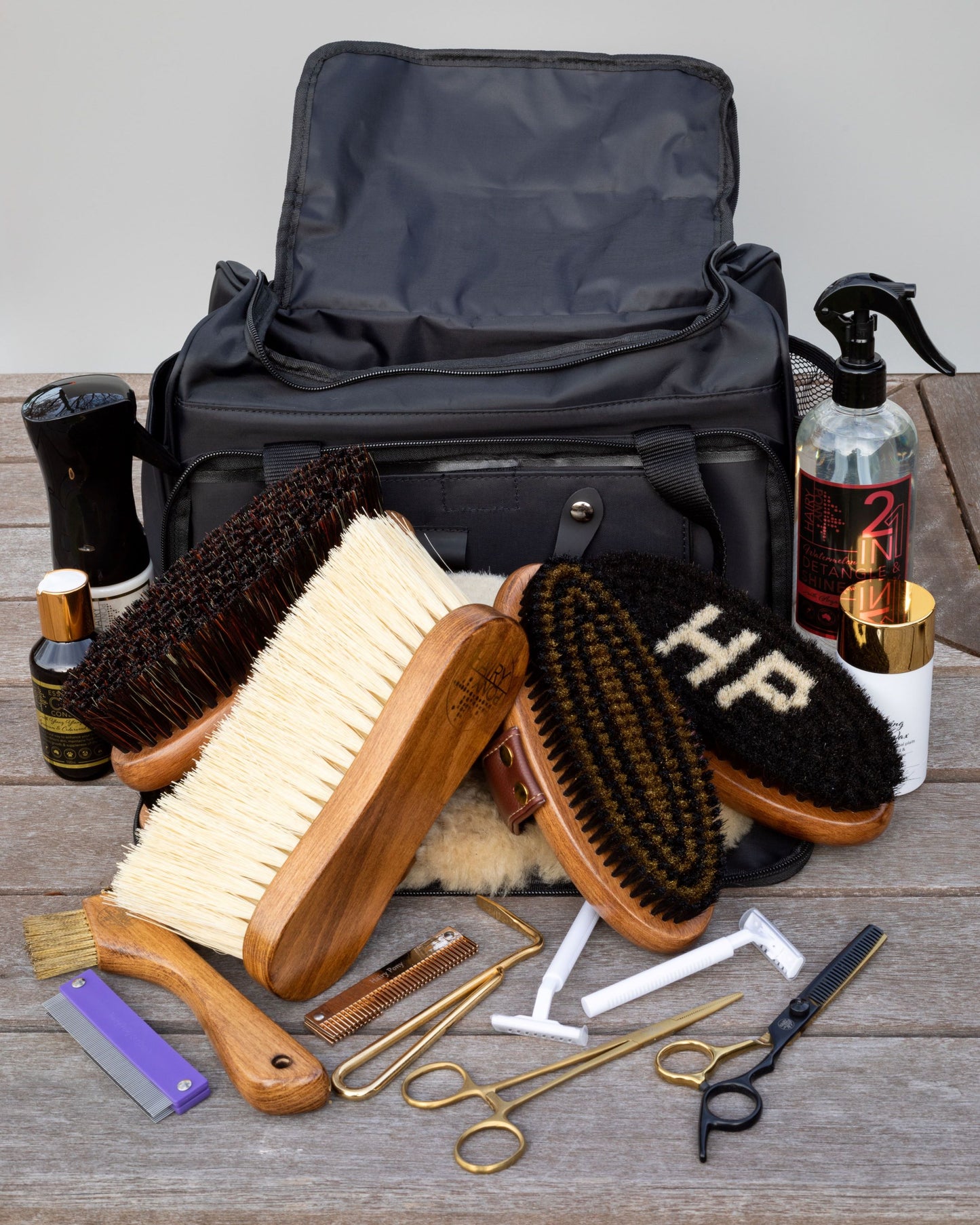 A view of various Hairy Pony grooming products including the Hairy Pony Flick Brush.