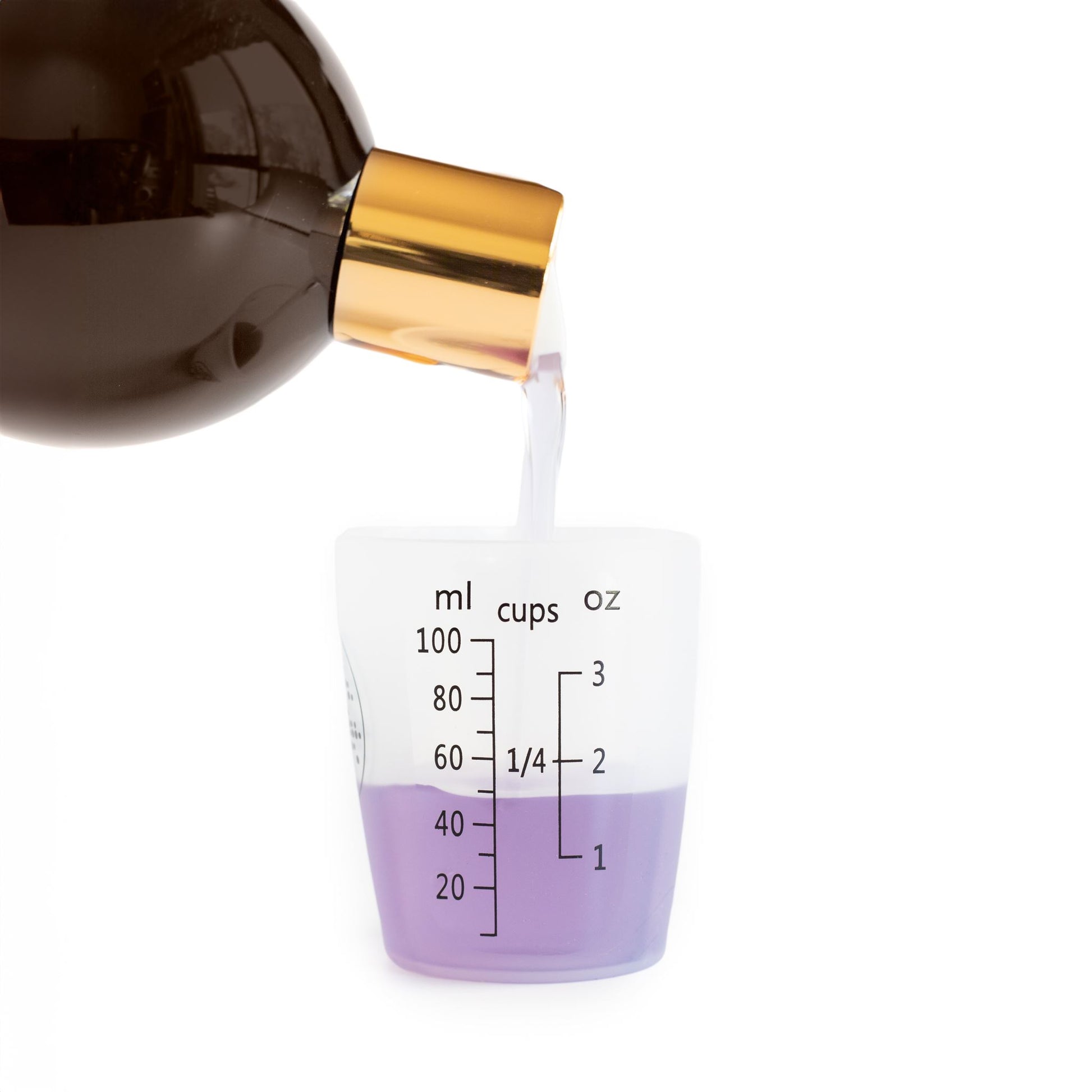 Essential Oil Coat Conditioner pouring in to Silicone Measuring Cup