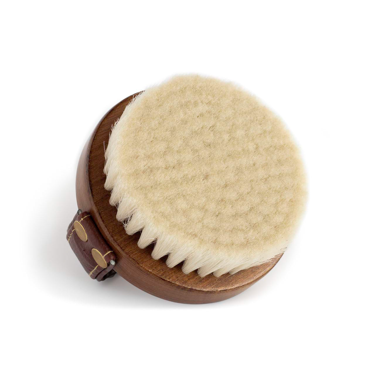 A view of the underside of the Hairy Pony Face Brush, with the soft, cream coloured bristles showing.