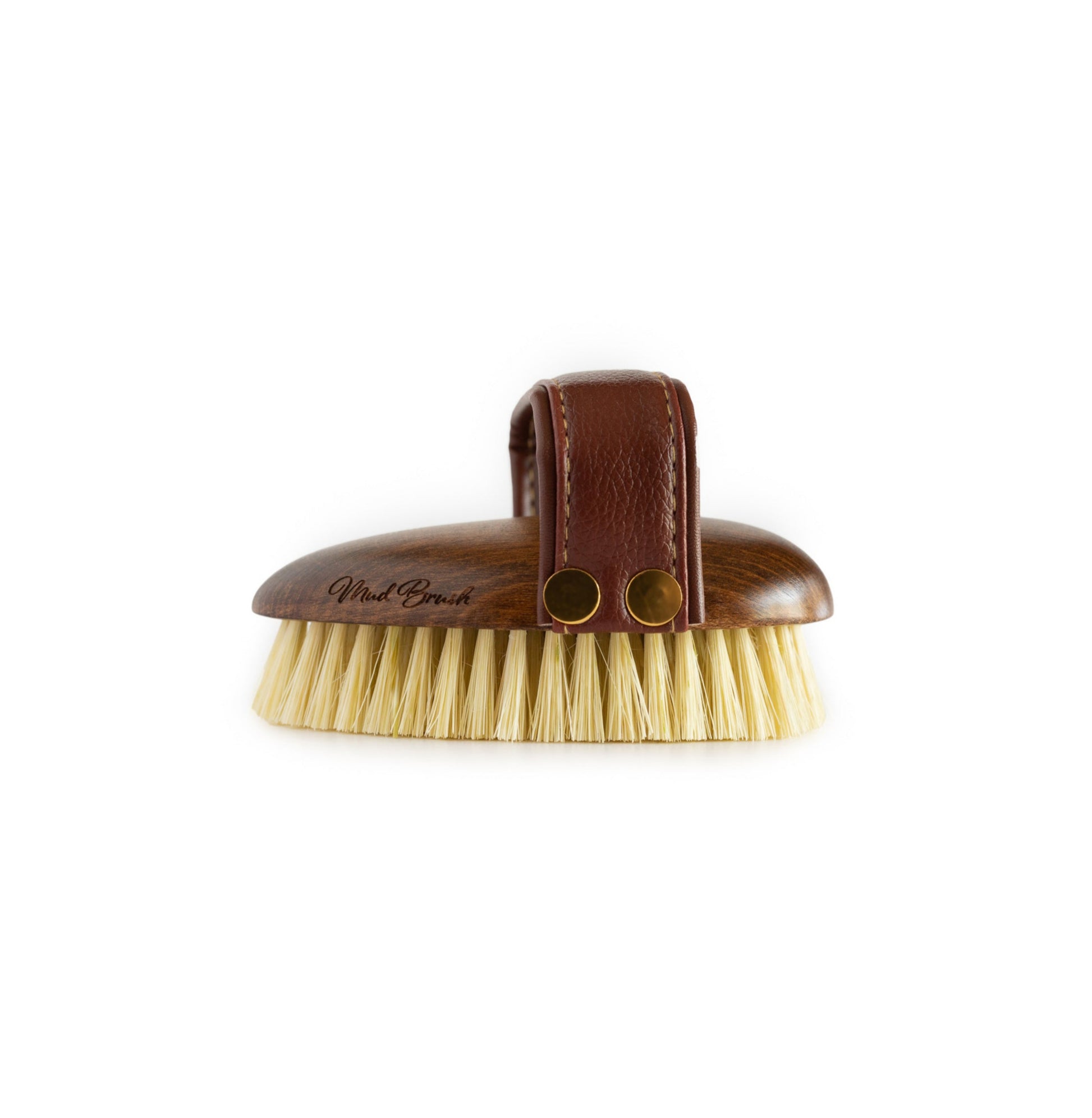 Side view of the Hairy Pony Mud Brush, showing the short, stiff bristles, and padded handle.