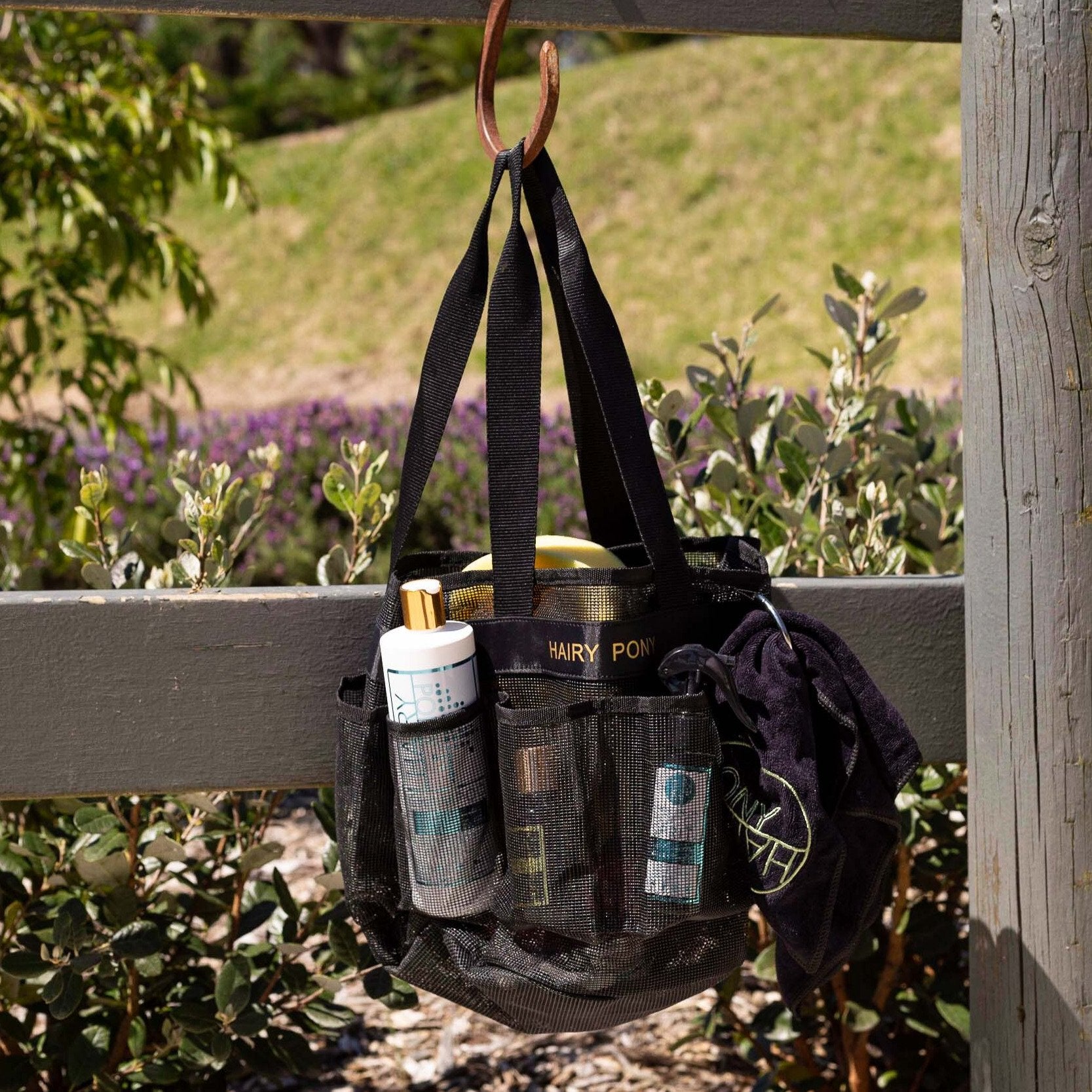 Horse Wash Bay Bag hanging on a fence