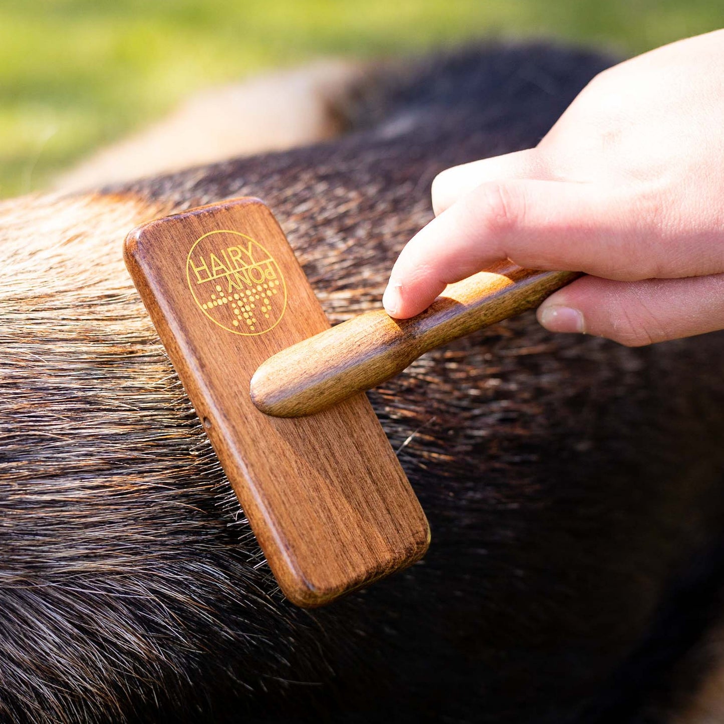 Pooch Deshedding Dog Brush being used on a dog coat