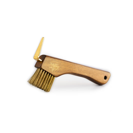 Our Hairy Pony Copper Bristle Hoof Pick is a wooden hoof pick featuring a Beechwood handle, with stiff gold copper bristles.