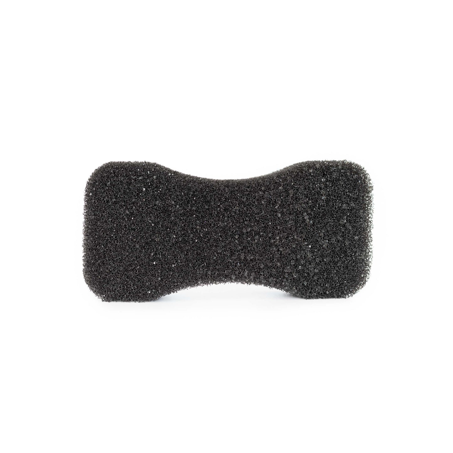 A photo of the Hairy Pony Compressed Scrubbing Horse Sponge after expanding with water. A black, coarse sponge on a white background.